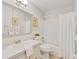 Neat bathroom with shower, tub, vanity, and decorative palm tree art for a relaxing space at 5356 81St N St # 26, St Petersburg, FL 33709