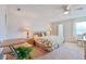 Serene bedroom with a large bed, soft lighting, neutral palette, and comfortable furnishings at 5356 81St N St # 26, St Petersburg, FL 33709