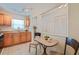 Cozy kitchenette features honey colored wood cabinets with track lighting at 5356 81St N St # 26, St Petersburg, FL 33709
