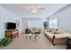 Cozy living room with plush sofas, natural light, ceiling fan, and classic wood furniture for a comfortable living space at 5356 81St N St # 26, St Petersburg, FL 33709