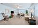 Sunlit living room with plush sofas, stylish tables, and a classic rocking chair at 5356 81St N St # 26, St Petersburg, FL 33709