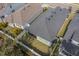 Aerial view of the house showing the roof, backyard, and surrounding neighborhood at 5538 Spanish Moss Cv, Bradenton, FL 34203