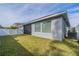 Fenced backyard featuring a lush lawn, screened in porch, and privacy fence at 5538 Spanish Moss Cv, Bradenton, FL 34203