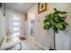 Inviting entryway featuring a marble table, decor and stylish tile flooring at 5538 Spanish Moss Cv, Bradenton, FL 34203