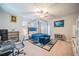 Calm main bedroom with four-poster bed, desk, and ample space for relaxation and work at 5538 Spanish Moss Cv, Bradenton, FL 34203