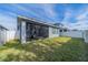 A screened porch with a dining table and chairs, perfect for outdoor dining at 5538 Spanish Moss Cv, Bradenton, FL 34203