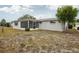 Expansive backyard featuring lush greenery and mature trees at 5620 Perkin Dr, New Port Richey, FL 34652