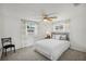 Bright bedroom with plush carpeting, neutral walls, with great natural light creating a warm and inviting atmosphere at 5620 Perkin Dr, New Port Richey, FL 34652