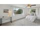Bright bedroom with large windows, plush carpet, and neutral decor at 5620 Perkin Dr, New Port Richey, FL 34652