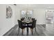 Inviting dining room with seating for four and a view of the screened porch at 5620 Perkin Dr, New Port Richey, FL 34652