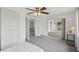 Bright main bedroom with carpet, closet and entry to the Florida room at 5620 Perkin Dr, New Port Richey, FL 34652
