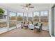 Enclosed sunroom filled with windows offering great light, providing a great view of the backyard at 5620 Perkin Dr, New Port Richey, FL 34652