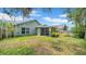An inviting backyard features a screened patio and lush green lawn space for outdoor enjoyment at 5825 Meadowpark Pl, Lithia, FL 33547