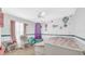 Charming bedroom features delightful wall art and whimsical accents at 5825 Meadowpark Pl, Lithia, FL 33547