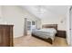 Cozy bedroom features neutral carpet, a fan, a window, and wooden furniture set at 5825 Meadowpark Pl, Lithia, FL 33547