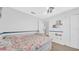Bedroom featuring carpet, fan, and a fun-themed wallpaper on the upper wall at 5825 Meadowpark Pl, Lithia, FL 33547