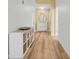 Inviting hallway with hardwood floors and stylish storage at 5825 Meadowpark Pl, Lithia, FL 33547