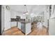 Open eat-in kitchen featuring granite countertops, stainless steel appliances, and a breakfast bar for additional seating at 5825 Meadowpark Pl, Lithia, FL 33547