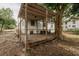 Backyard showcasing a deck, mature trees, and lush landscaping, providing a private outdoor space at 601 N Franklin St, Plant City, FL 33563