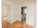 View of a bathroom through a door with white vanity, toilet and shower with modern features at 601 N Franklin St, Plant City, FL 33563