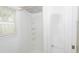 Bright white shower stall with built in shelving and a window at 601 N Franklin St, Plant City, FL 33563