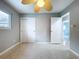 This bedroom offers neutral walls, a ceiling fan, and closet storage space at 6268 39Th N Ave, St Petersburg, FL 33709