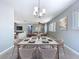 Inviting dining room set for a meal, featuring a large table and a view into the living area at 6268 39Th N Ave, St Petersburg, FL 33709