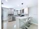 Bright kitchen featuring modern cabinetry, stainless steel appliances, and a stylish breakfast bar at 6268 39Th N Ave, St Petersburg, FL 33709
