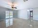 Open living room with a ceiling fan and sliding glass doors that offer seamless access to the outdoors at 6268 39Th N Ave, St Petersburg, FL 33709