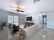 Bright living room with stylish furniture, a ceiling fan, and sliding glass doors to the pool area at 6268 39Th N Ave, St Petersburg, FL 33709