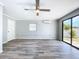 This room features laminate flooring, a ceiling fan and glass sliding doors to the outside at 6268 39Th N Ave, St Petersburg, FL 33709