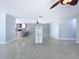 Spacious living room featuring terrazzo floors and an open layout with access to the kitchen and outdoor area at 6268 39Th N Ave, St Petersburg, FL 33709