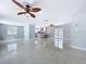 This living room showcases sleek flooring and an open floorplan leading to the kitchen at 6268 39Th N Ave, St Petersburg, FL 33709