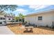 Landscaped backyard with a cozy firepit area, patio and an outdoor seating area perfect for entertaining at 6325 9Th S Ave, Gulfport, FL 33707