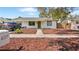 Inviting single-story home with green trimmed windows, a walkway, and freshly mulched landscape at 6325 9Th S Ave, Gulfport, FL 33707