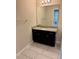 Single sink bathroom with granite countertops and a tiled floor at 6325 Yellow Buckeye Dr, Riverview, FL 33578