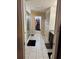 Hallway featuring an en suite bathroom with a glass shower and walk-in closet at 6325 Yellow Buckeye Dr, Riverview, FL 33578