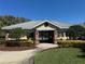 Exterior shot of the community clubhouse, walkway, and lush landscaping at 6325 Yellow Buckeye Dr, Riverview, FL 33578