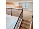 Second floor landing with decorative railing and carpet floors at 6325 Yellow Buckeye Dr, Riverview, FL 33578