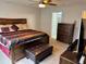 Cozy bedroom with a ceiling fan and an en suite bathroom at 6325 Yellow Buckeye Dr, Riverview, FL 33578