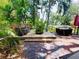 Landscaped backyard featuring a deck, outdoor seating, and lush greenery at 6429 Gulfport Blvd. South Blvd, South Pasadena, FL 33707