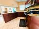 Well lit kitchen featuring tile flooring, granite countertops, and stainless steel appliances at 6429 Gulfport Blvd. South Blvd, South Pasadena, FL 33707