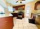 Well-maintained kitchen with stainless steel appliances, wood cabinets, and granite countertops at 6429 Gulfport Blvd. South Blvd, South Pasadena, FL 33707