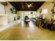 Cozy living room with a dark wood plank ceiling, fireplace, comfortable seating, and modern lighting fixtures at 6429 Gulfport Blvd. South Blvd, South Pasadena, FL 33707