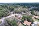 Aerial view of a neighborhood featuring mature trees and views of the city at 7117 Wrenwood Cir, Tampa, FL 33617