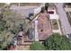 Aerial view of a backyard with a screened pool, patio, mature trees and lush landscaping at 7117 Wrenwood Cir, Tampa, FL 33617