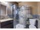 Bathroom with a walk-in shower featuring slate-style tile and a glass door at 7117 Wrenwood Cir, Tampa, FL 33617