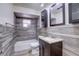 Cozy bathroom featuring a tub/shower combo and a dark-stained vanity at 7117 Wrenwood Cir, Tampa, FL 33617