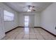 Bedroom with tile flooring, a sliding glass door to the lanai, and natural light at 7117 Wrenwood Cir, Tampa, FL 33617