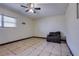 Bedroom featuring tile floors, ceiling fan, window, and chair at 7117 Wrenwood Cir, Tampa, FL 33617